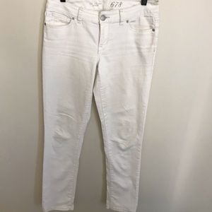 The limited white mid rise denim